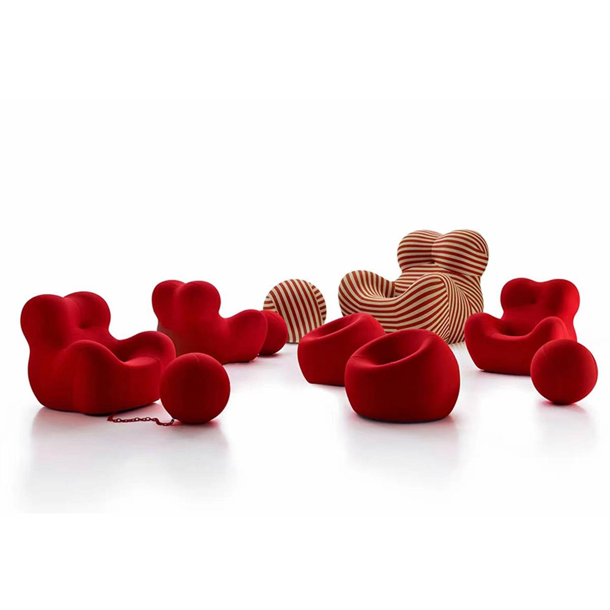Collection of red and striped lounge chairs and ottomans on a white background