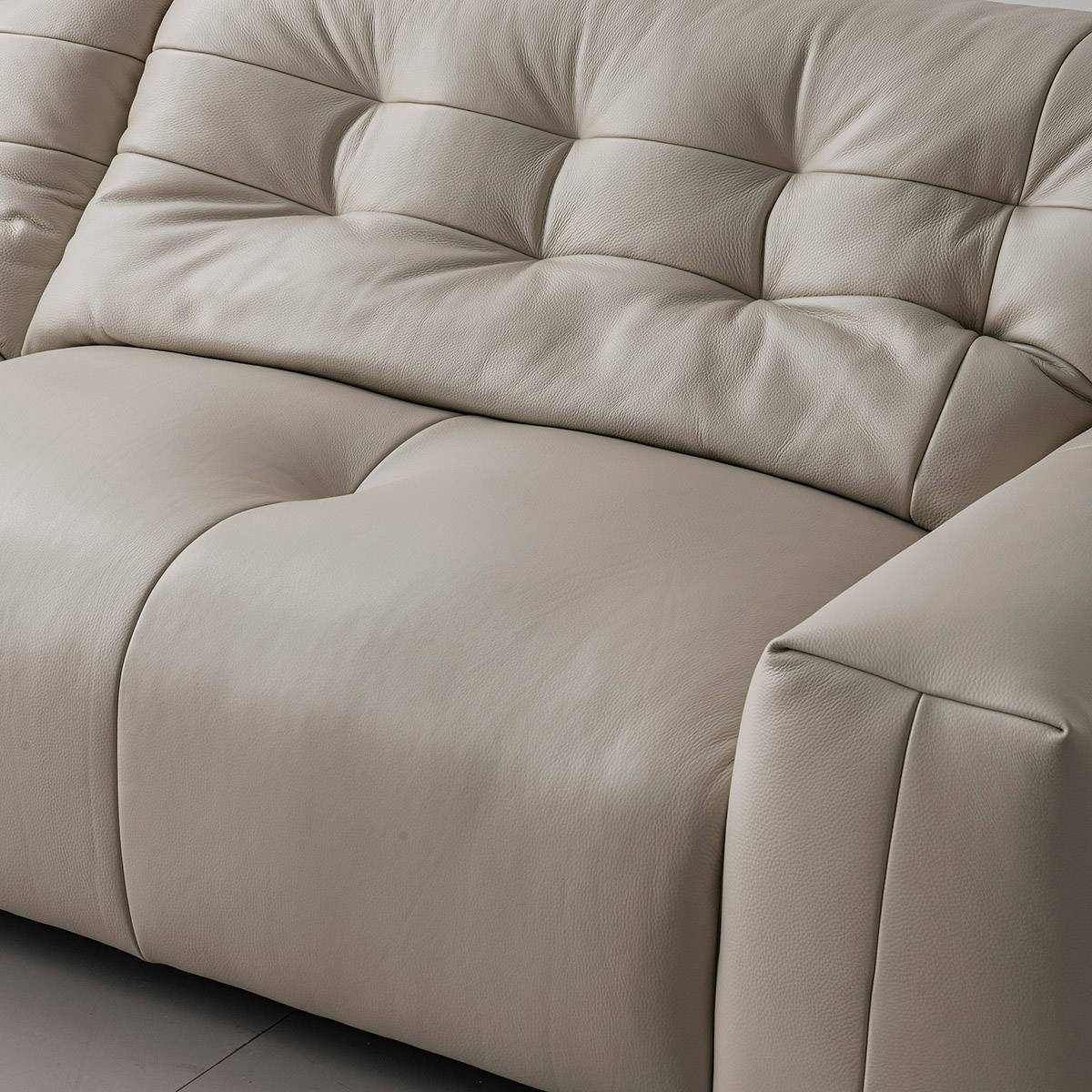 Close-up of the tufted backrest and seat cushion texture