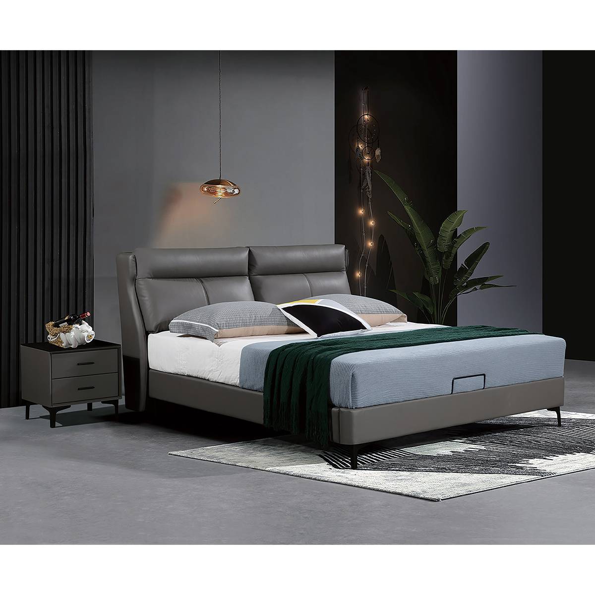 Grey upholstered bed in a modern bedroom setting with a bedside table and rug