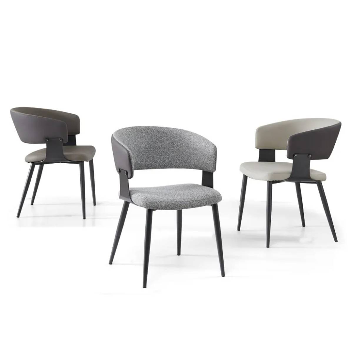 Three modern dining chairs in dark grey, grey linen, and light grey arranged in a studio setting