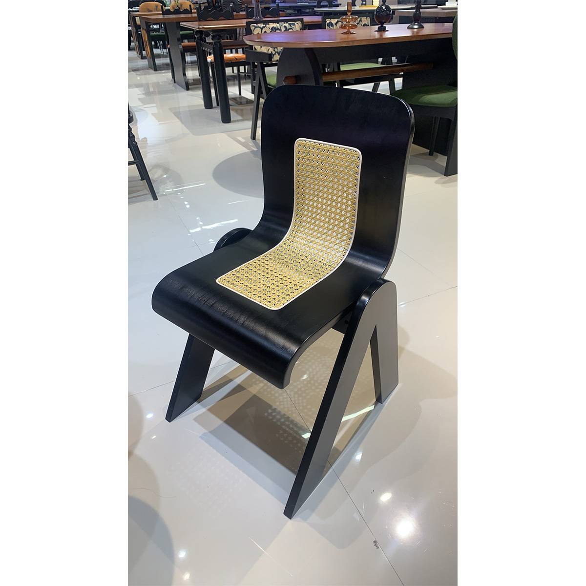 Front view of the black mid-century dining chair showing the curved oak frame