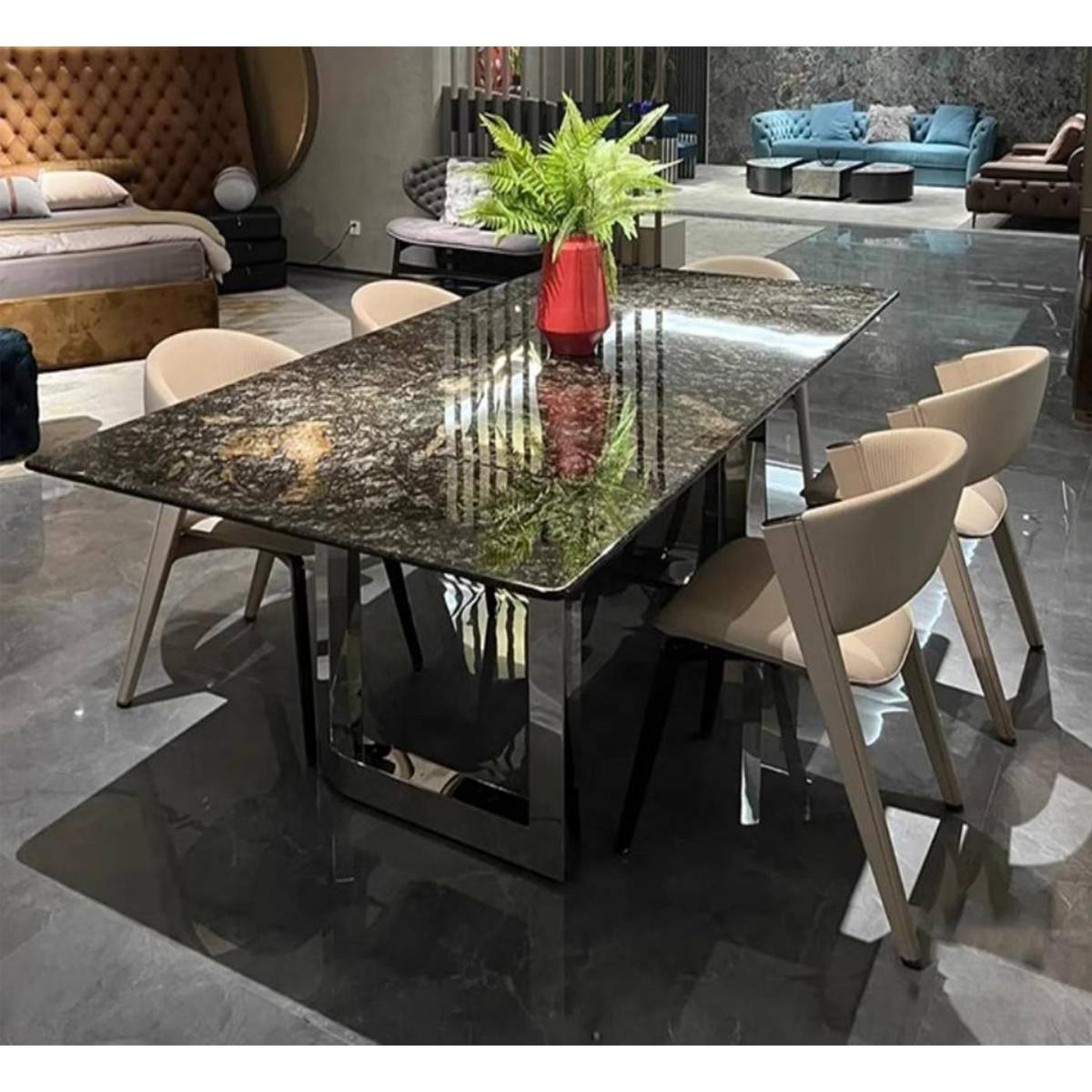 Platinum Diamond marble dining table with stainless steel base in a showroom setting