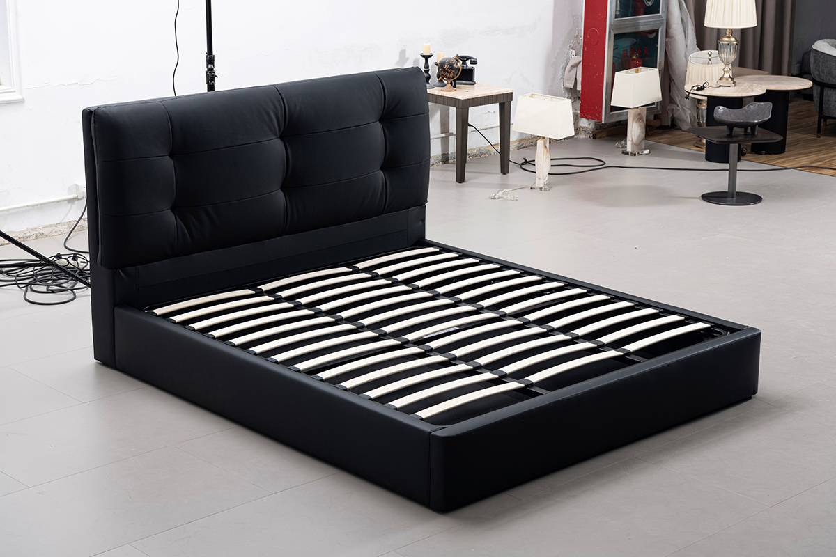 Black leather upholstered bed frame with wooden slats