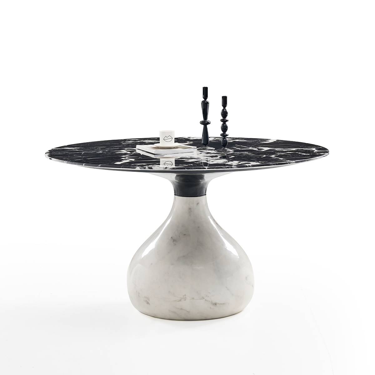 Side view of the round dining table showing the sculptural base