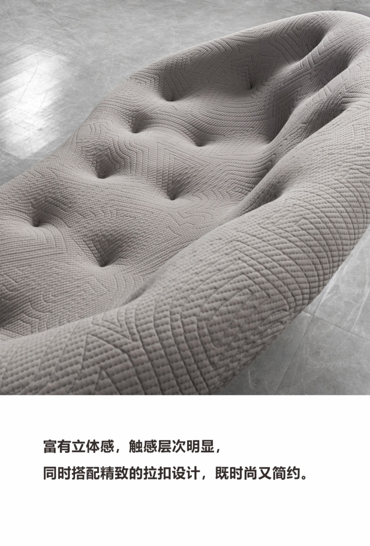 Close-up of the sofa's 3D textured fabric and button-tufting design