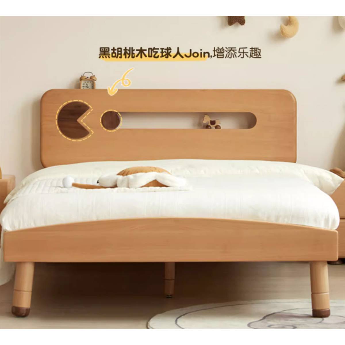 Close-up of the bed headboard showing the Pac-Man design detail.