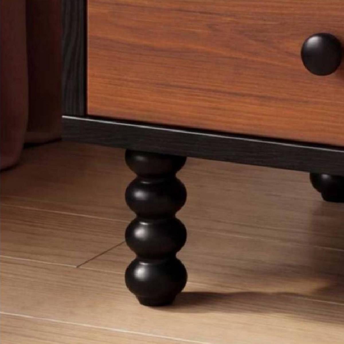 Close-up detail of the turned leg and drawer