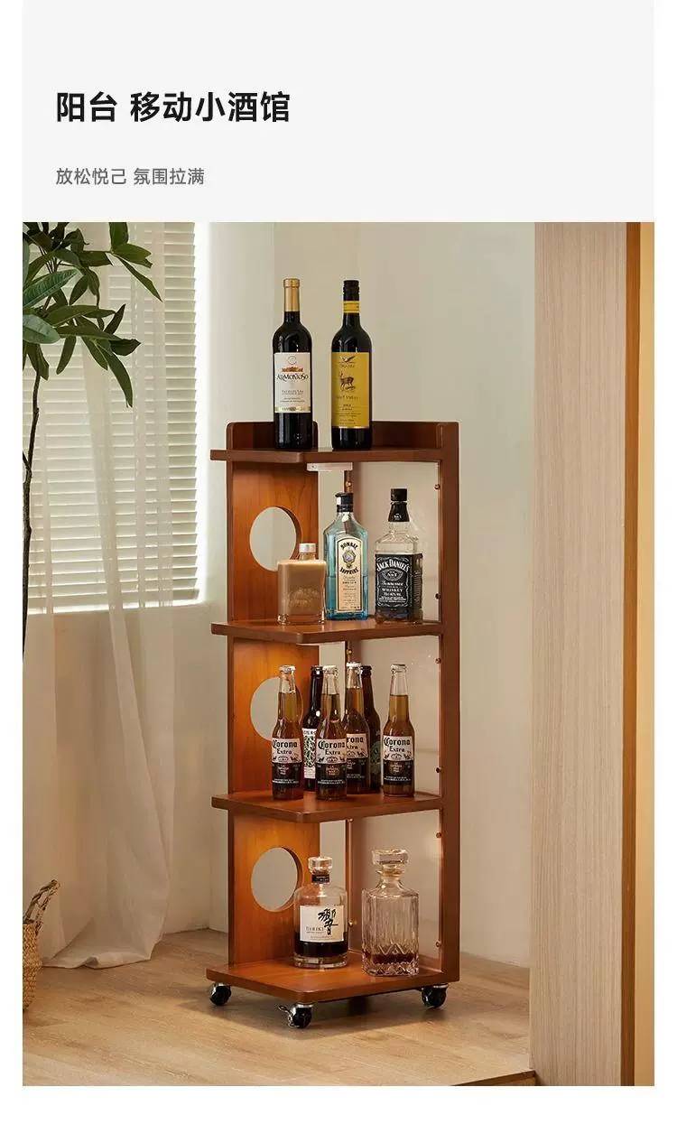 Cabinet used as a mobile bar cart on a balcony with wine bottles