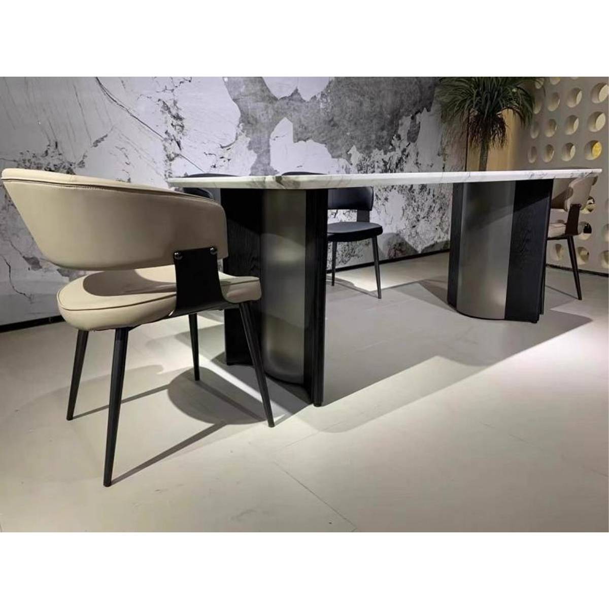 Side view of the dining table highlighting the stainless steel and wood base structure.
