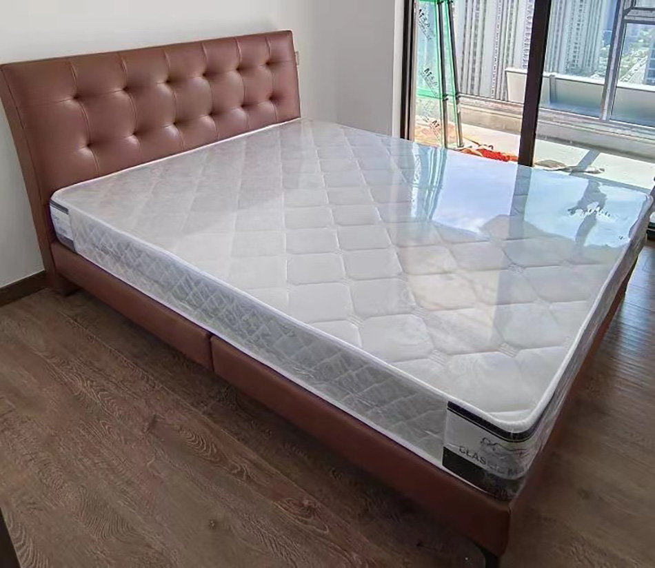 Brown leather upholstered bed with tufted headboard