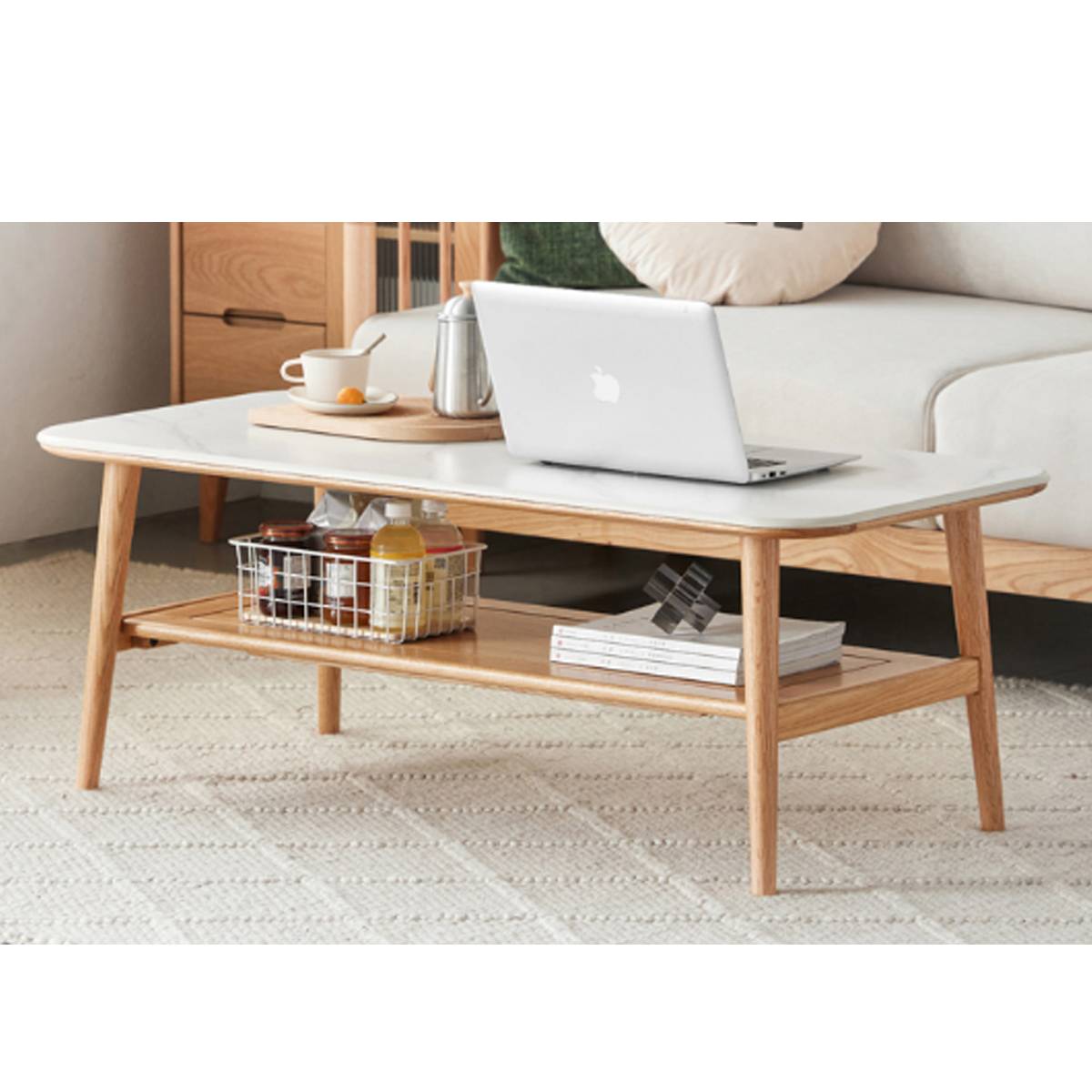 Santa Rosa coffee table in natural wood finish with a laptop and accessories