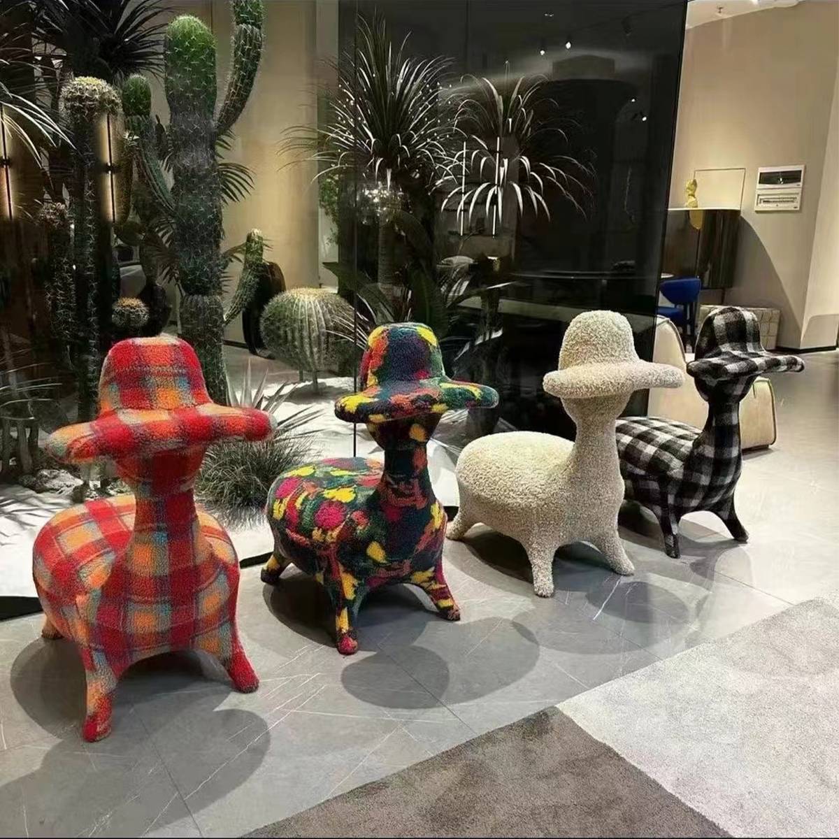 Four duck chairs in different patterns displayed in a showroom