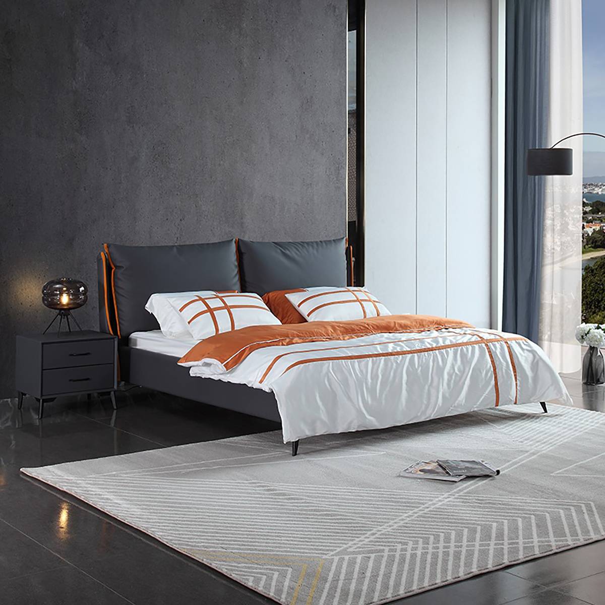 Bedroom setting showing the bedside cabinet beside a bed with white and orange bedding