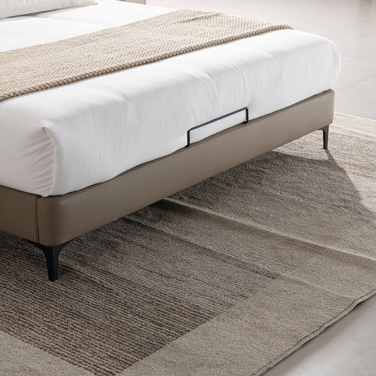 Side view of the bed frame showing the storage drawer handle and legs