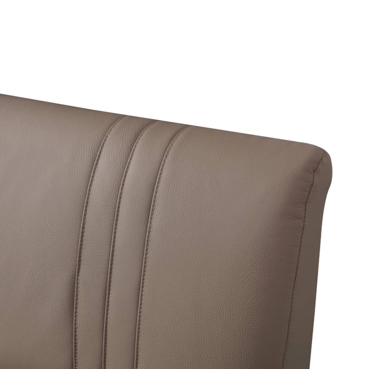 Detail shot of the headboard leather texture and stitching