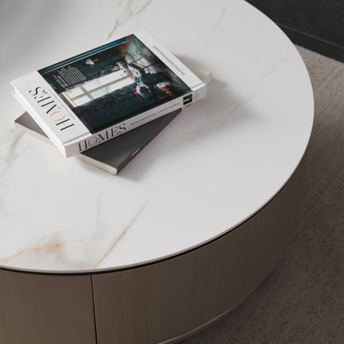 Close-up of the white sintered stone tabletop with books