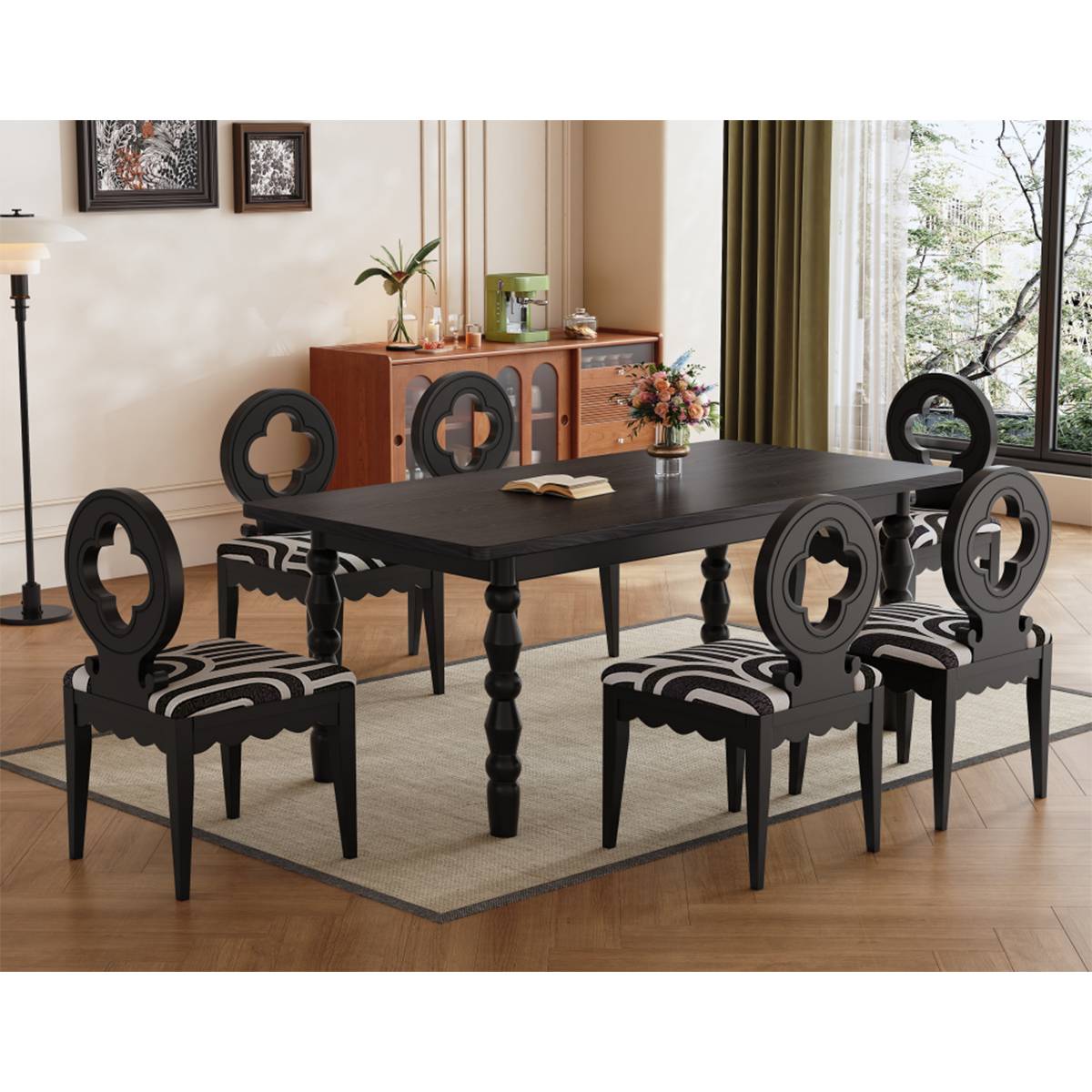 Black dining table with six chairs in a dining room setting