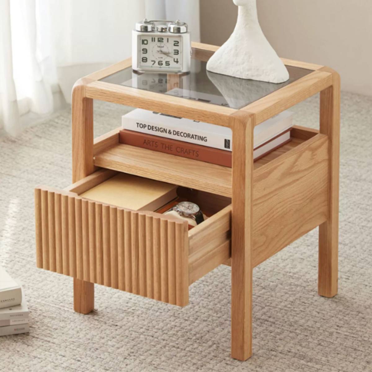 Side view of the bedside table with the drawer pulled open
