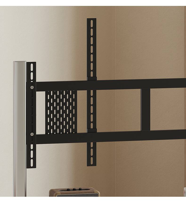 Close-up of the black metal TV mounting bracket attached to the stainless steel frame.