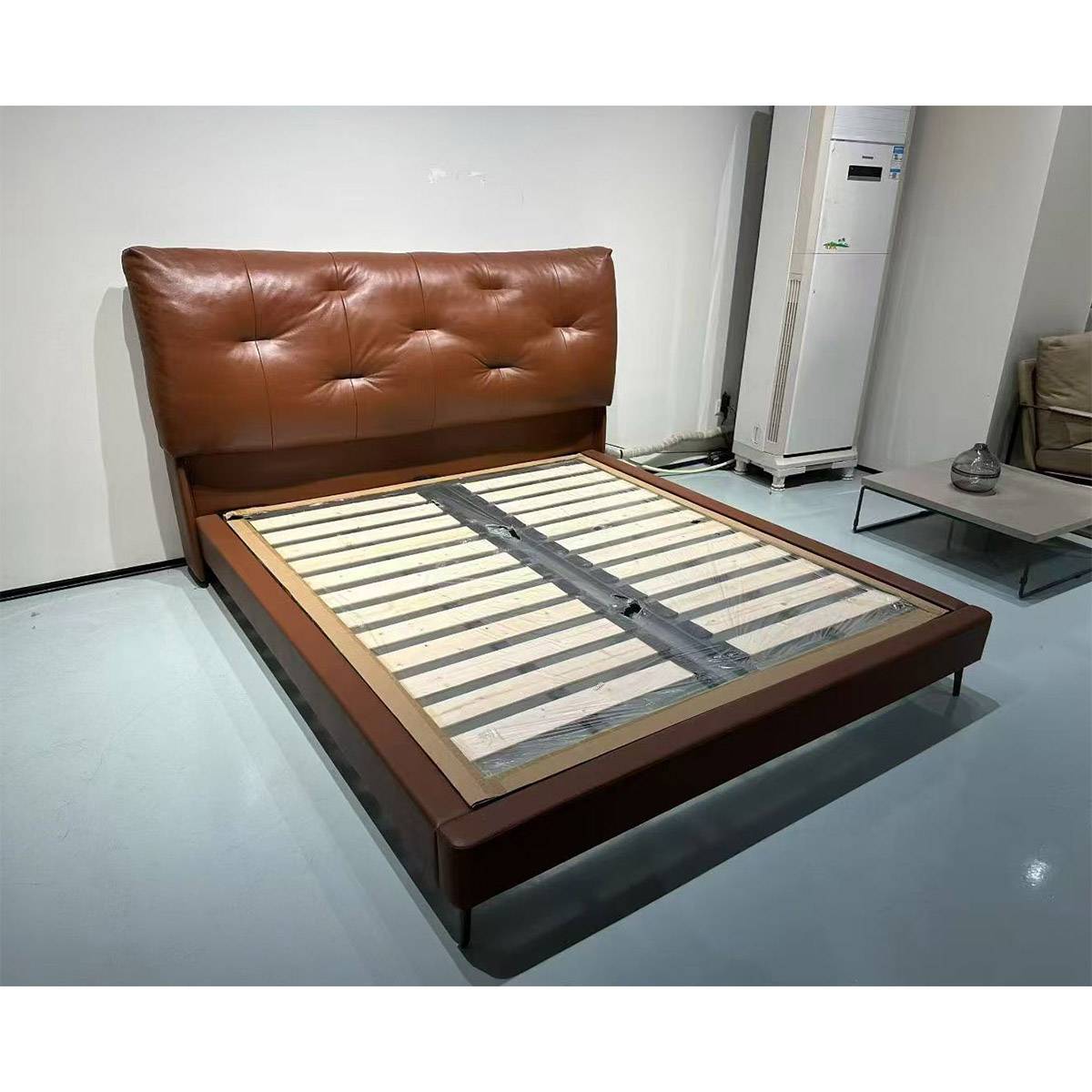 Three-quarter view of the bed frame in a showroom