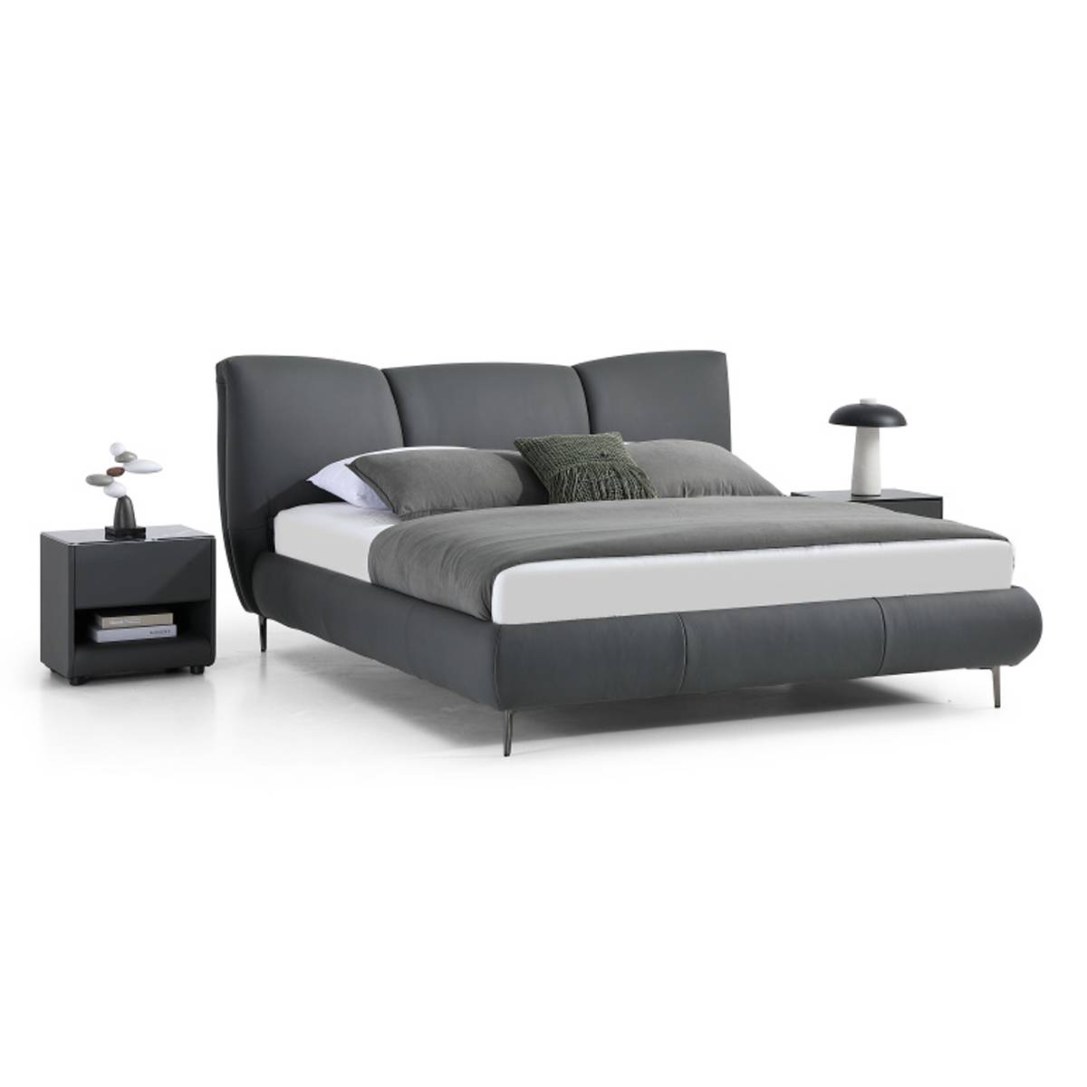 Side angle view of the grey leather bed highlighting the headboard shape and bedding