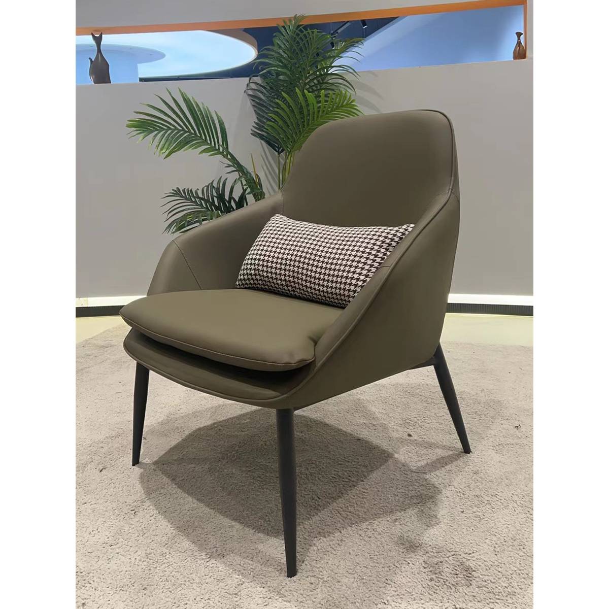 Three-quarter view of the lounge chair in a showroom setting