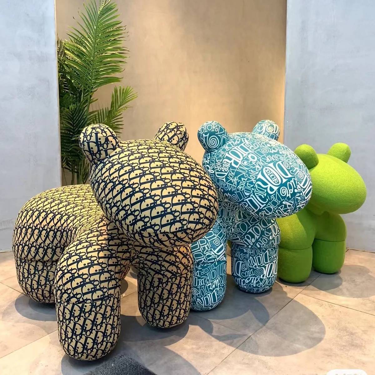 Group shot of horse stools in yellow, teal, and green patterns