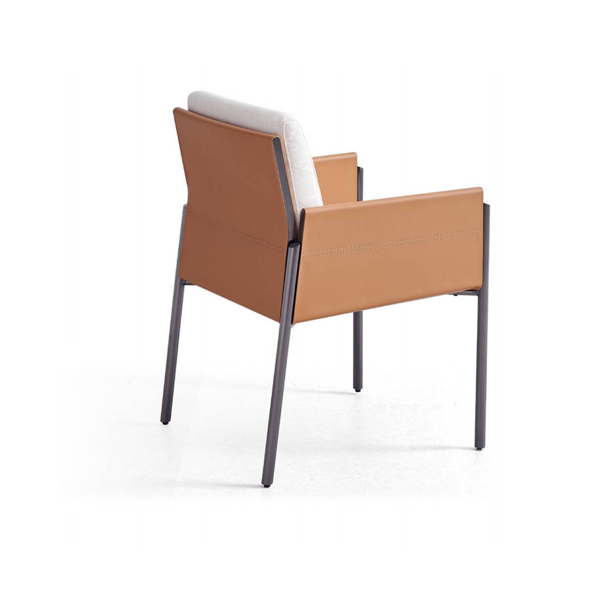 Rear side view of the Z67 saddle leather dining chair showing the stainless steel legs and leather back panel