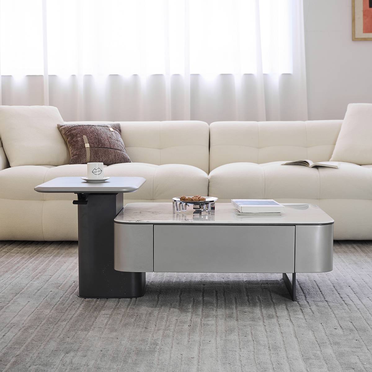 Front view of the coffee table showing the main table and raised side table.