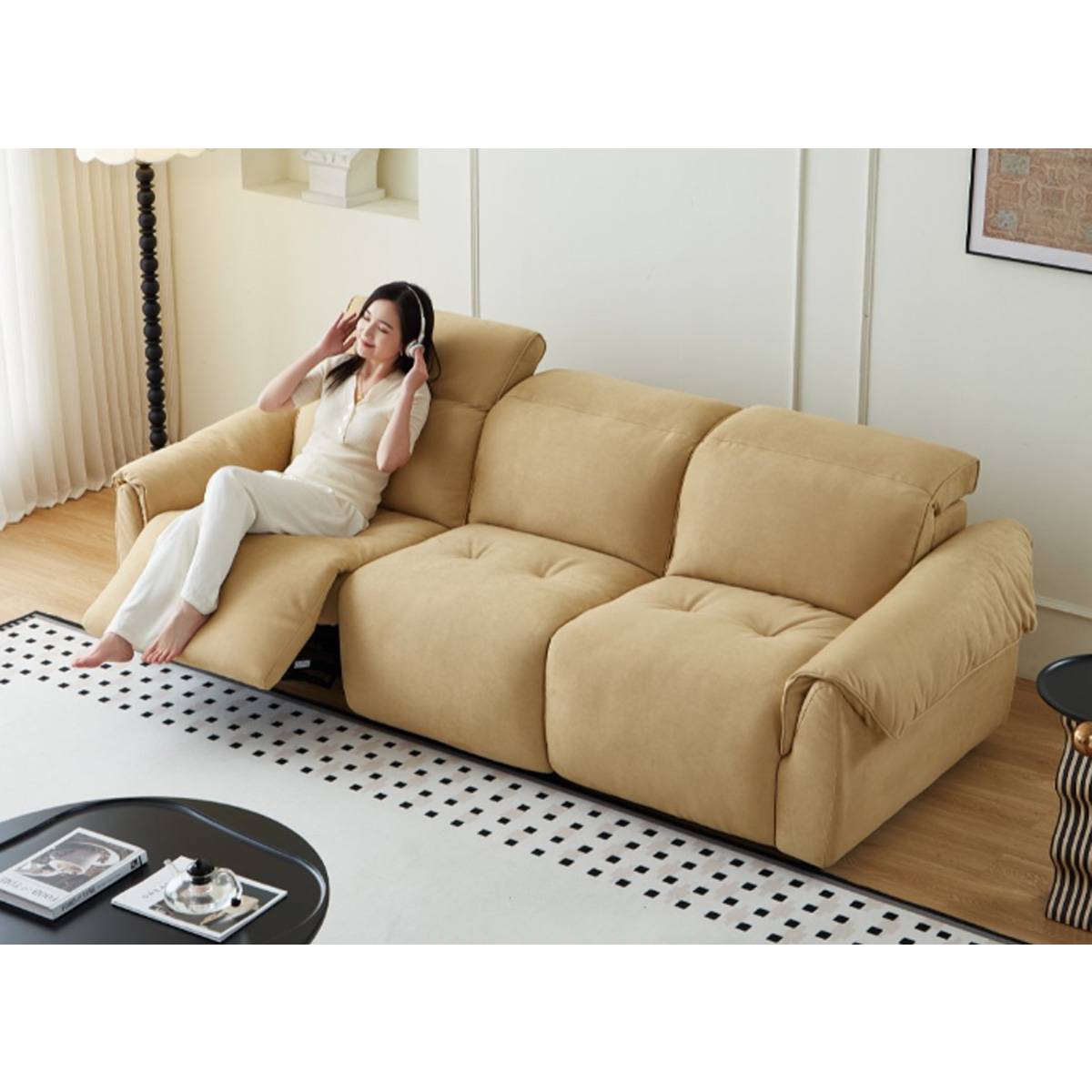 Woman wearing headphones on a ginger yellow fabric functional sofa