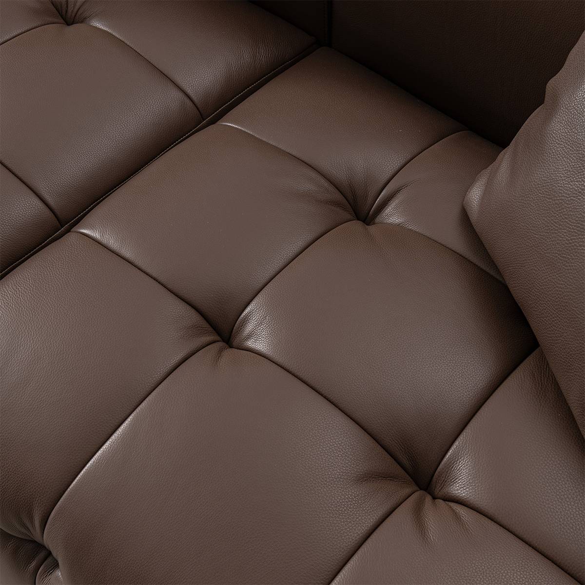 Close-up detail of the tufted seat cushions