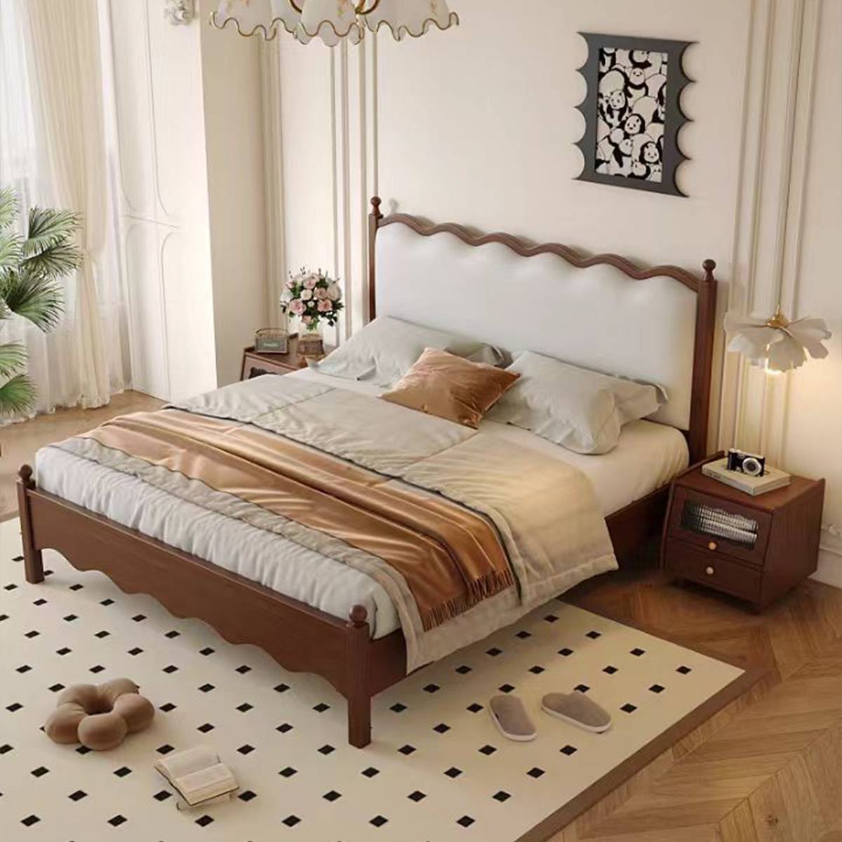 Angled view of a cherry wood mid-century solid wood bed with cream leather headboard
