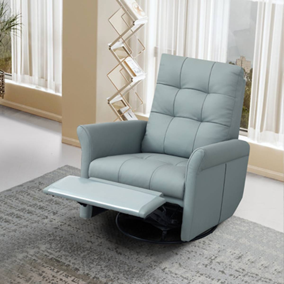 Light blue genuine leather manual recliner swivel chair with ottoman on a grey rug