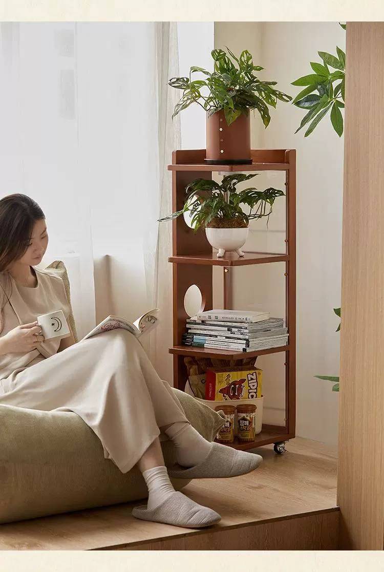 Side cabinet used as a bookshelf next to a sofa