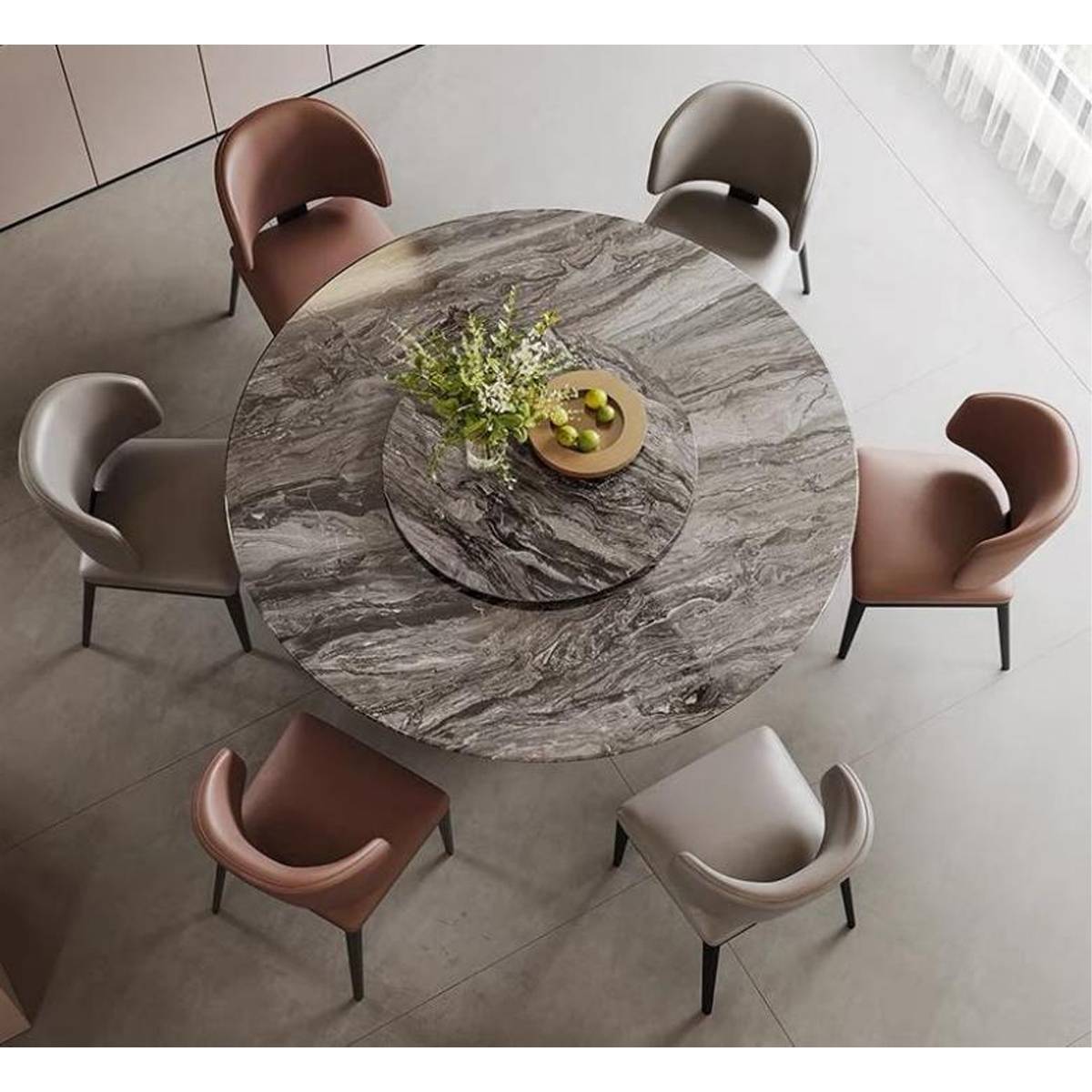 Overhead view of the round marble dining table showing the rotating tray and surrounding chairs