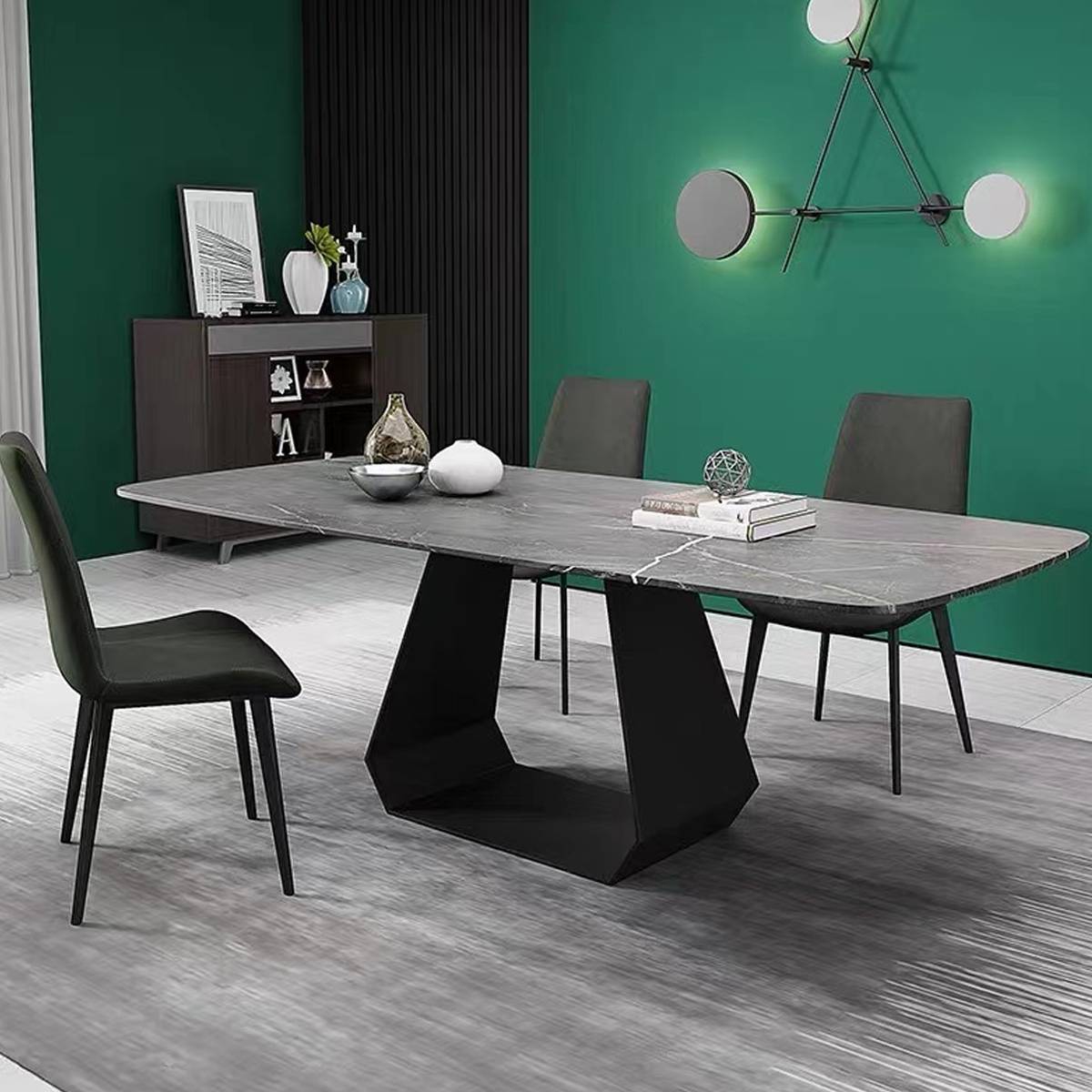 Grey sintered stone dining table in a room with green walls