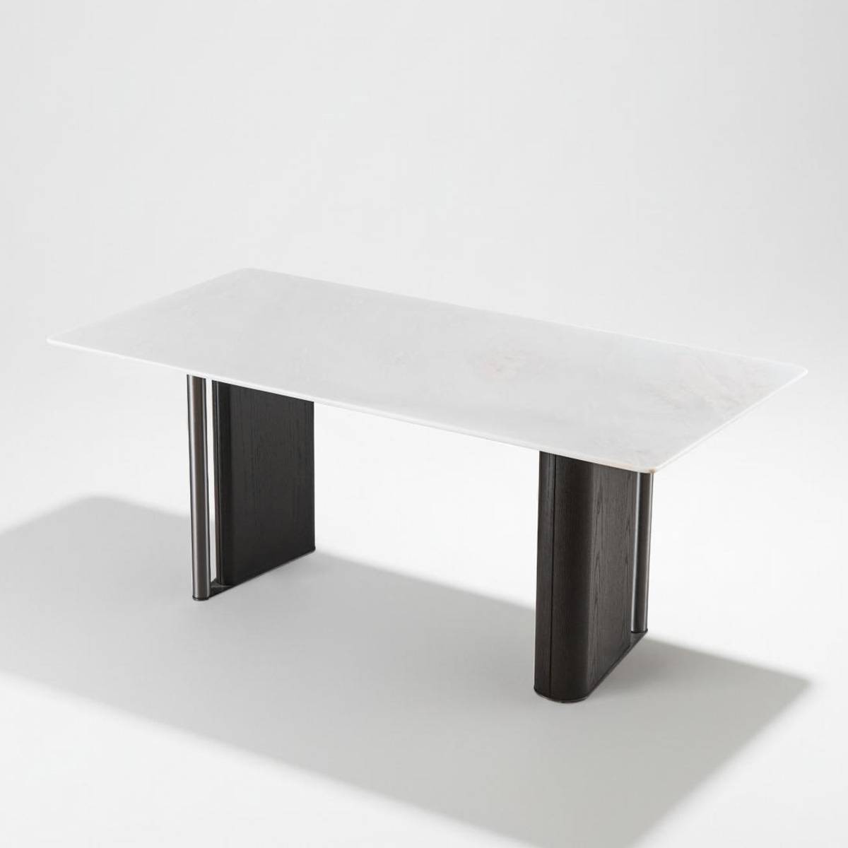 Studio shot of the dining table showing the white stone top and dark base