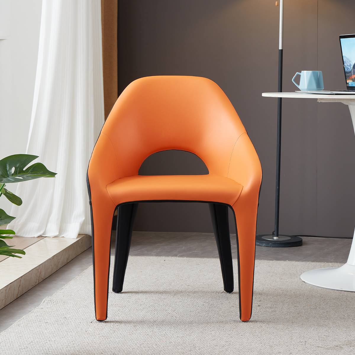 Front view of an orange and black modern lounge chair