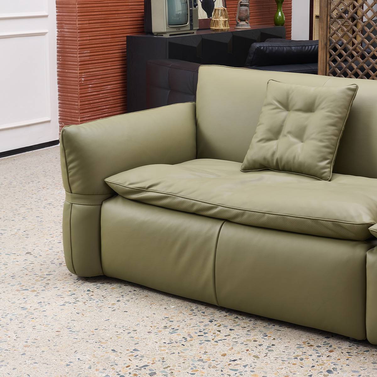 Close-up detail of the sofa armrest and seat cushion texture