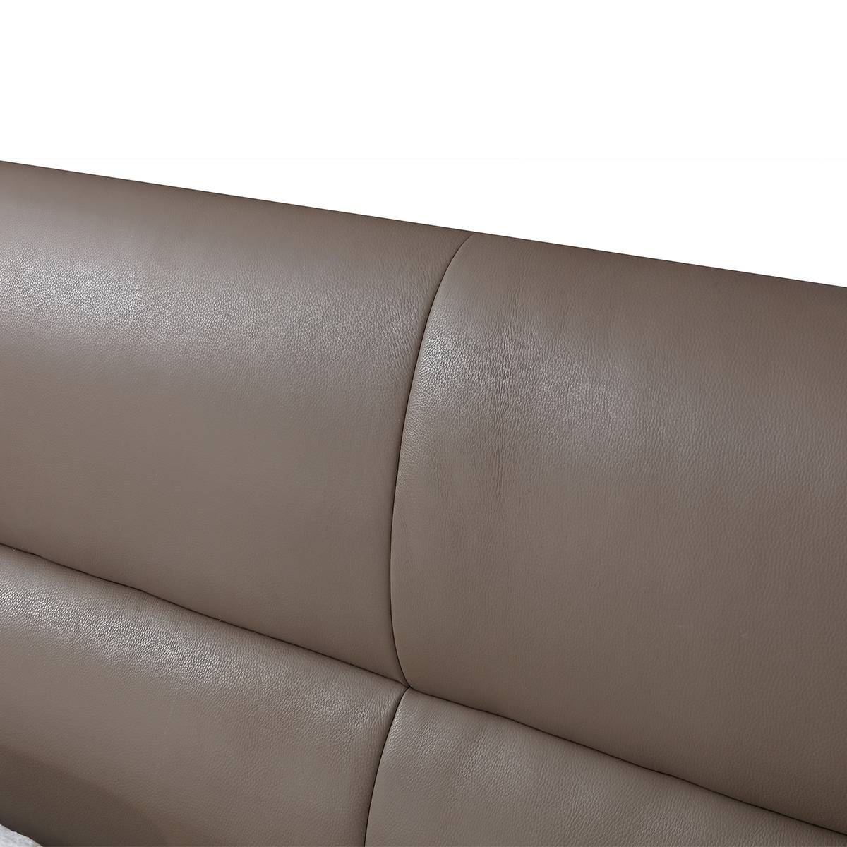 Close-up detail of the taupe top-grain leather headboard showing texture and stitching.