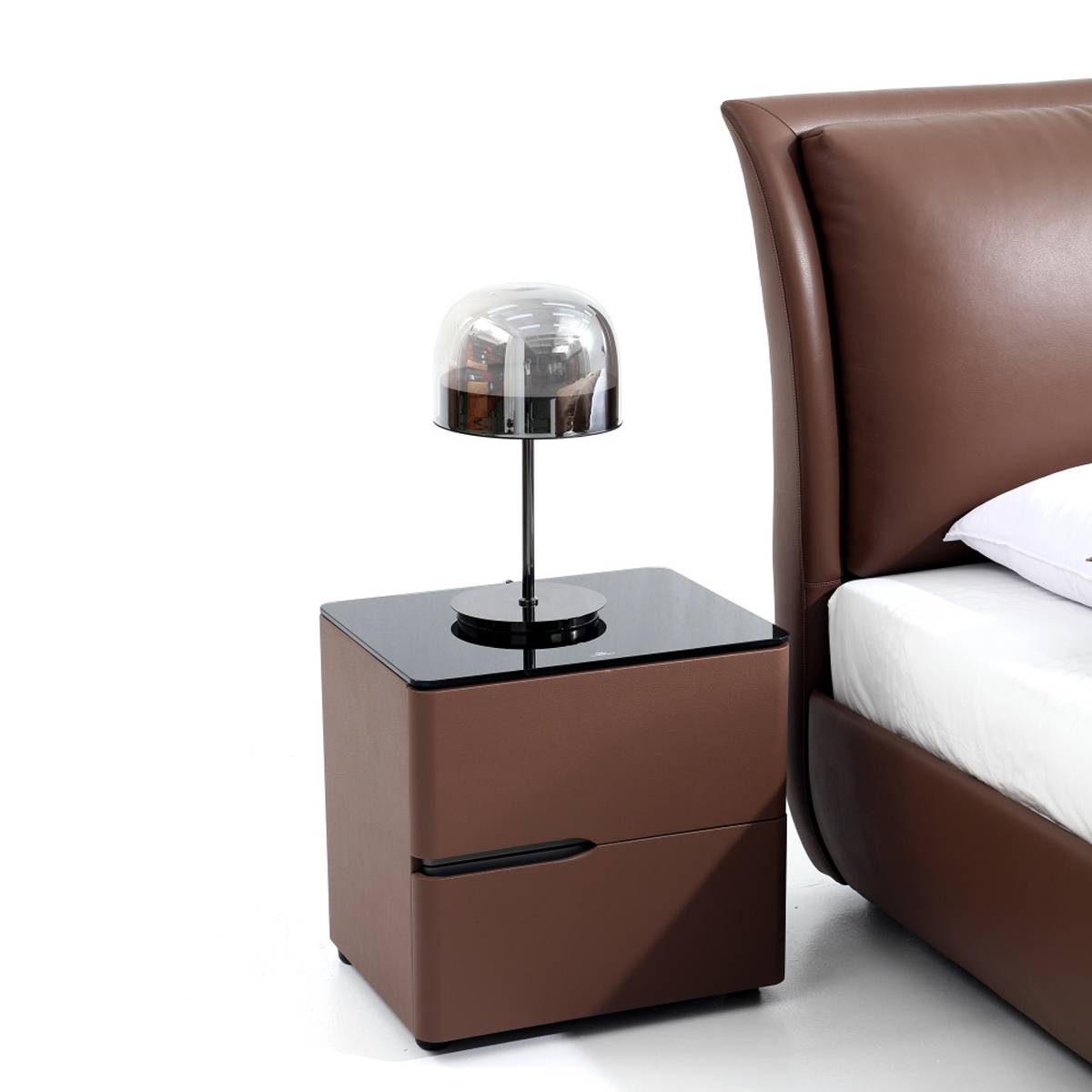 Close-up of brown leather bed frame corner showing stitching and structure