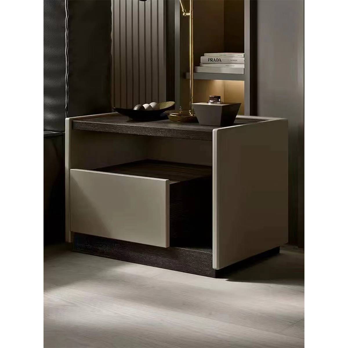 Bedside table in bedroom setting with decor items