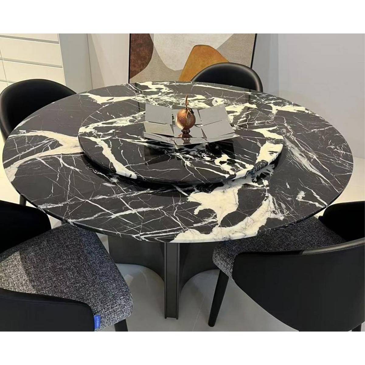 Close-up view of the marble tabletop showing the texture and the rotating tray.