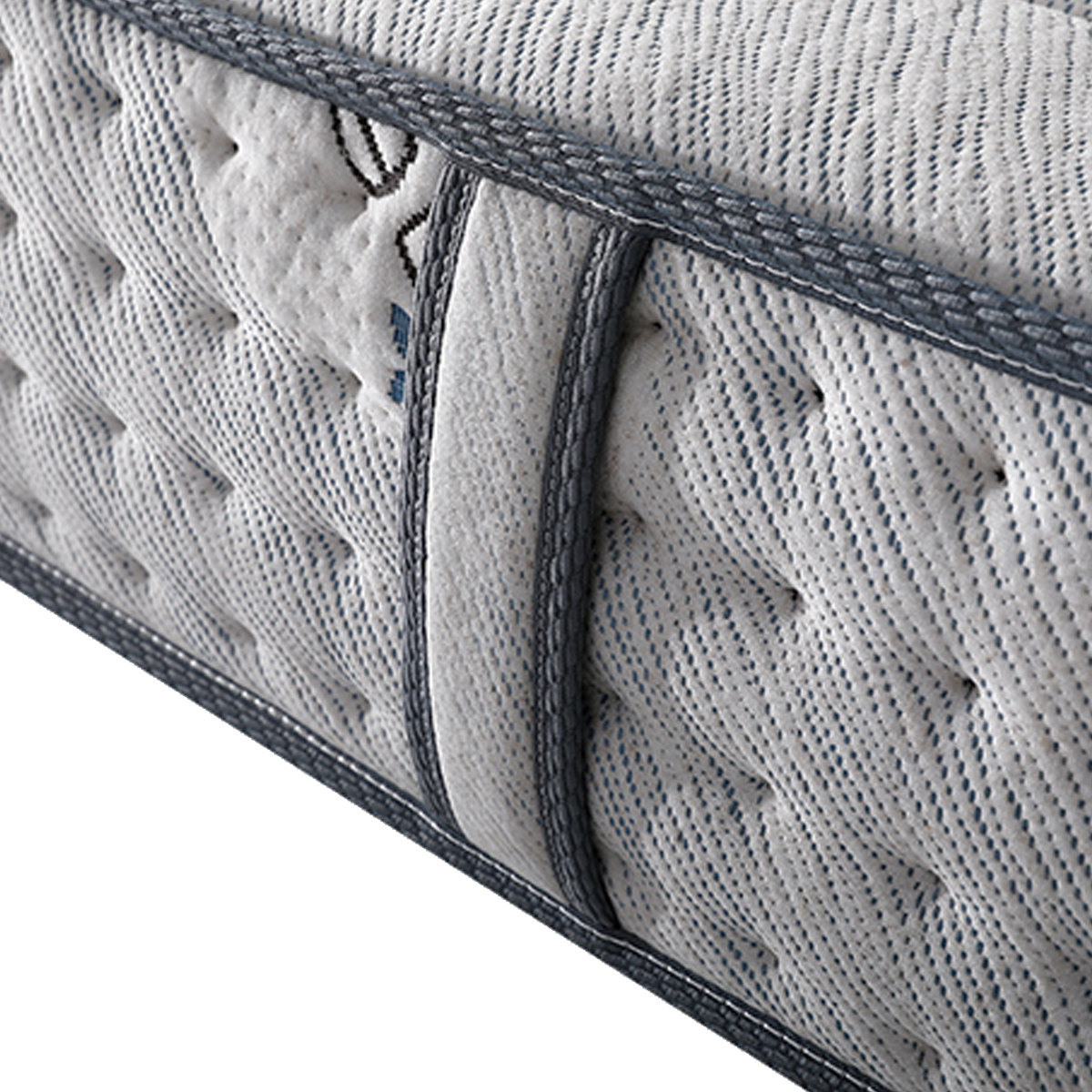 Close-up detail of the mattress side showing the fabric texture and stitching