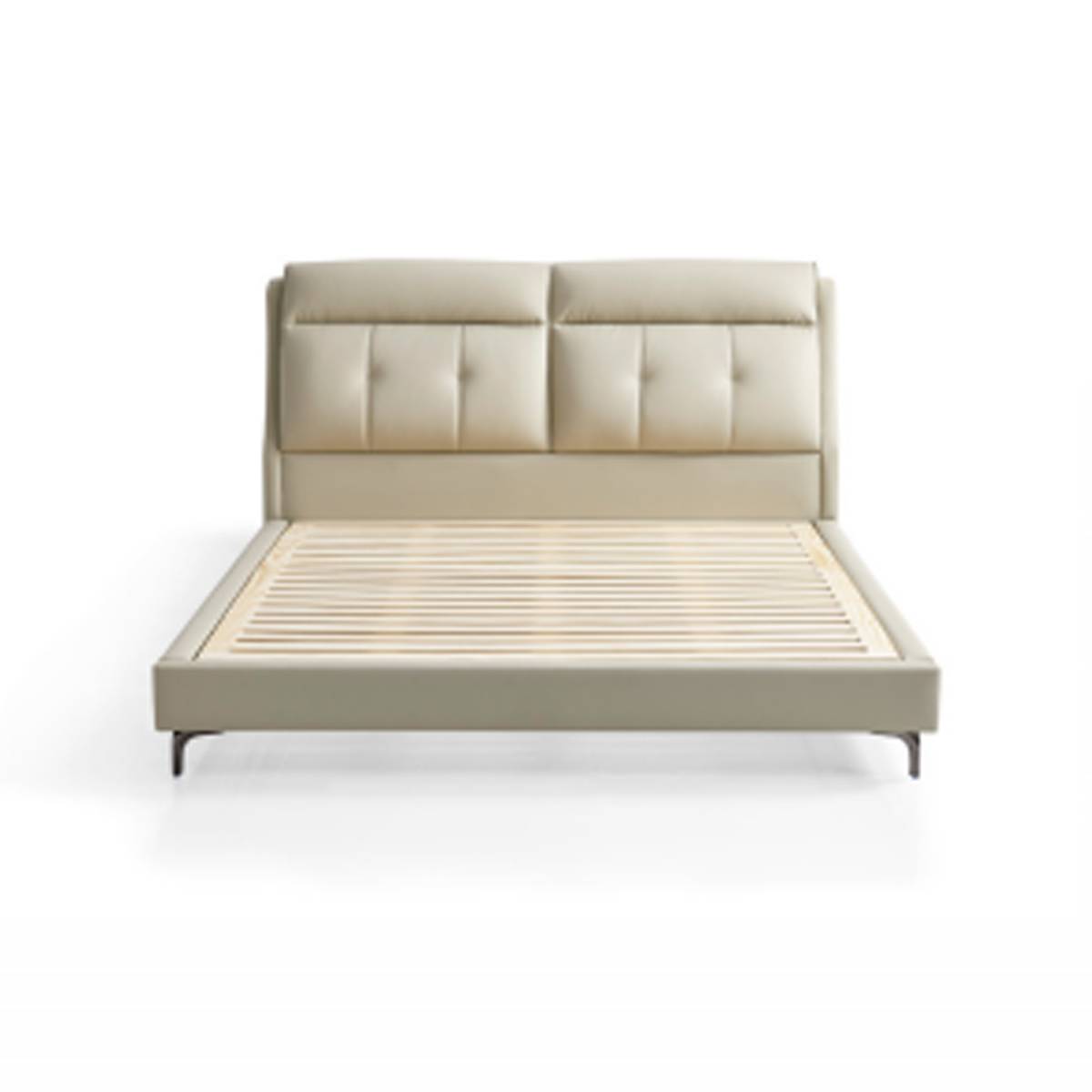 Front view of the beige leather upholstered bed showing the headboard and base