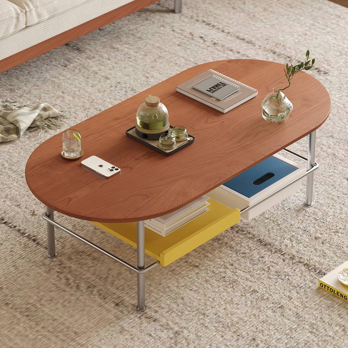 High-angle view of the coffee table showing the layout of items on the table and the storage trays.