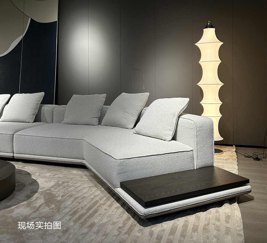 Close-up of the sofa seat and integrated side table