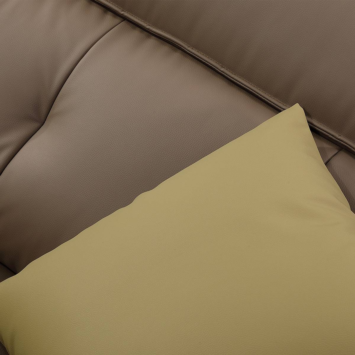 Close-up detail of the sofa upholstery texture and yellow cushion