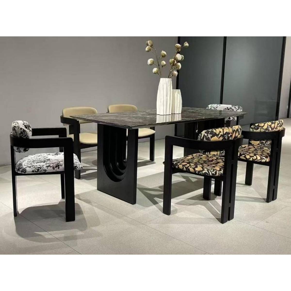 Full view of the dining table set with chairs and a vase