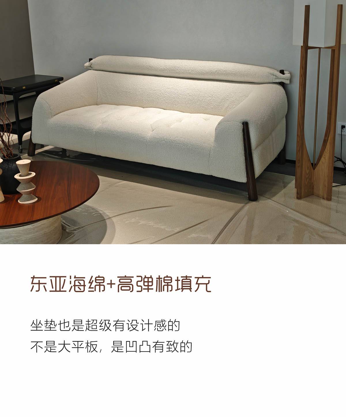Full view of the white fabric sofa in a living room setting
